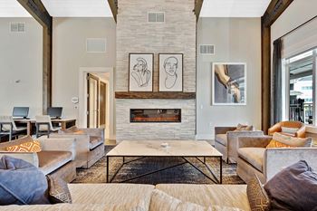 Resident lounge with kitchen, dining space and fireplace